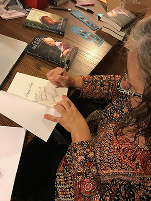 Cindy writing note card